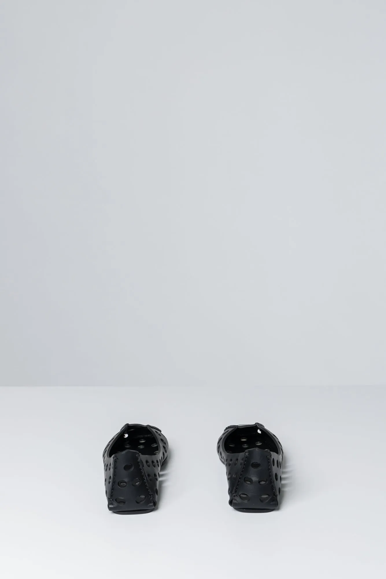 Alaïa Perforated Ballet Flats in Black